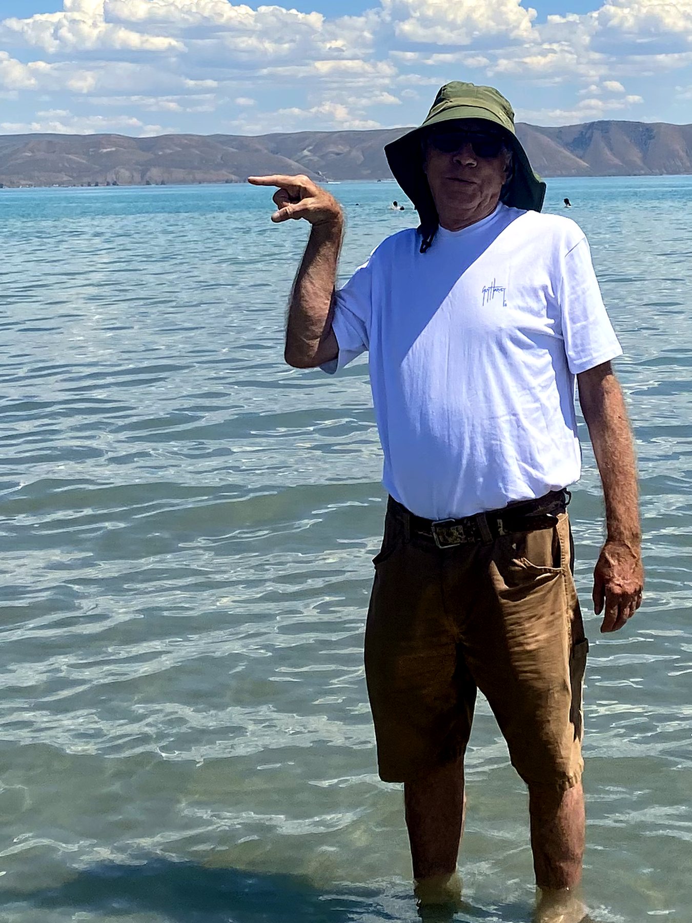 Pastor Mike Kestler standing in a mountain lake